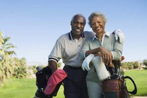 older couple playing golf as a recreational program for seniors