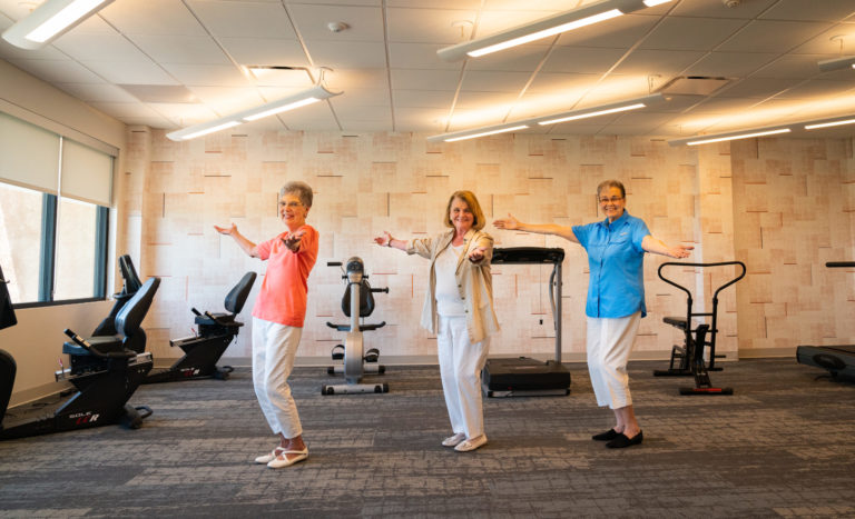 three senior resident women in exercise class