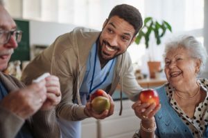 nurse with apples providing services in assisted living