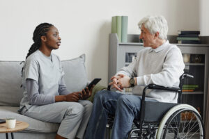 Woman talks to senior about the purpose of respite care