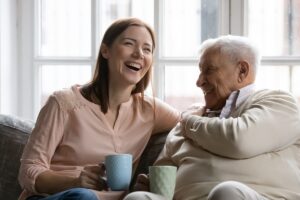 Woman chats with senior about things to do with someone who has Alzheimer's