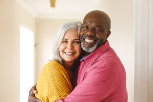 Senior couple hugs one another as they short-term senior rehab in Angelo, TX