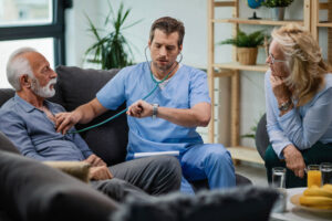 Doctor checks senior's vitals while explaining the importance of short-term rehab for seniors