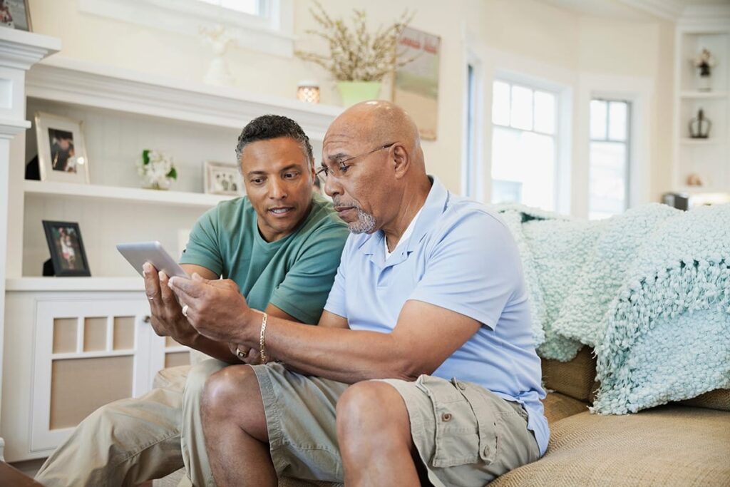 Man tries to show father how to use cell phone while wondering, "does my parent need memory care?"