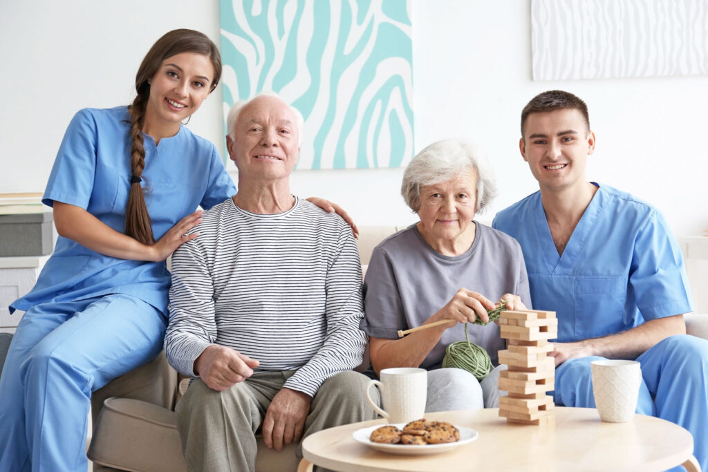 People gather on couch after discussing personal assistance services vs. home health care