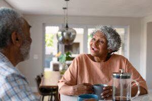 Senior living provides safety and peace of mind and helps build connections for the man and woman in conversation.