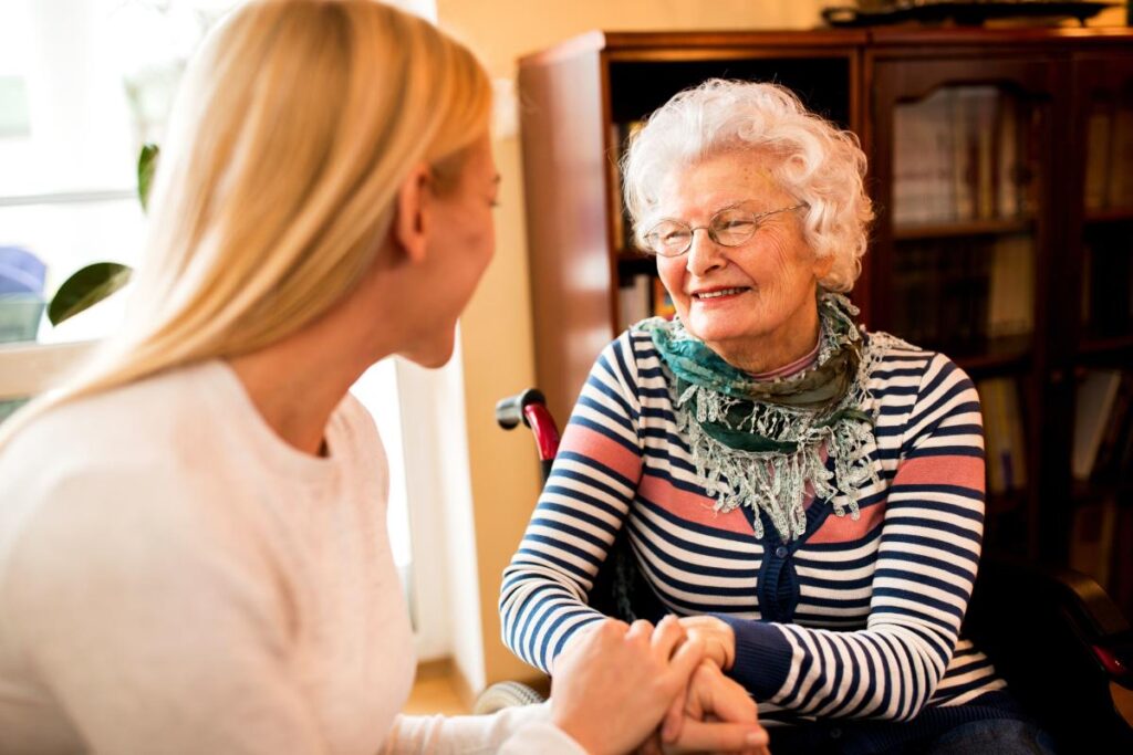 What are frequently asked questions about senior living? A senior adult gets her questions answered by a team member.