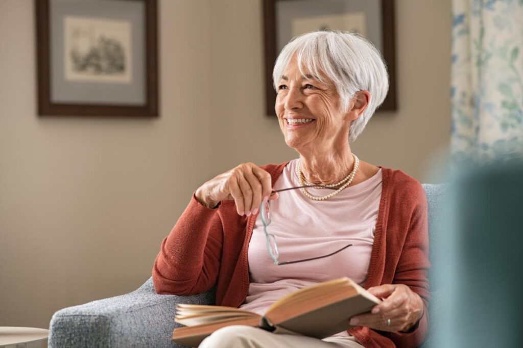 A senior adult woman is enjoying mental and physical wellness in assisted living.